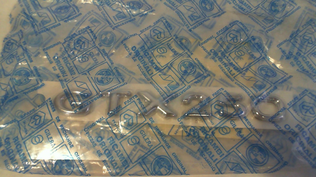 TARGH.LATERALE " GTX 250" HEXAGON PIAGGIO 576029